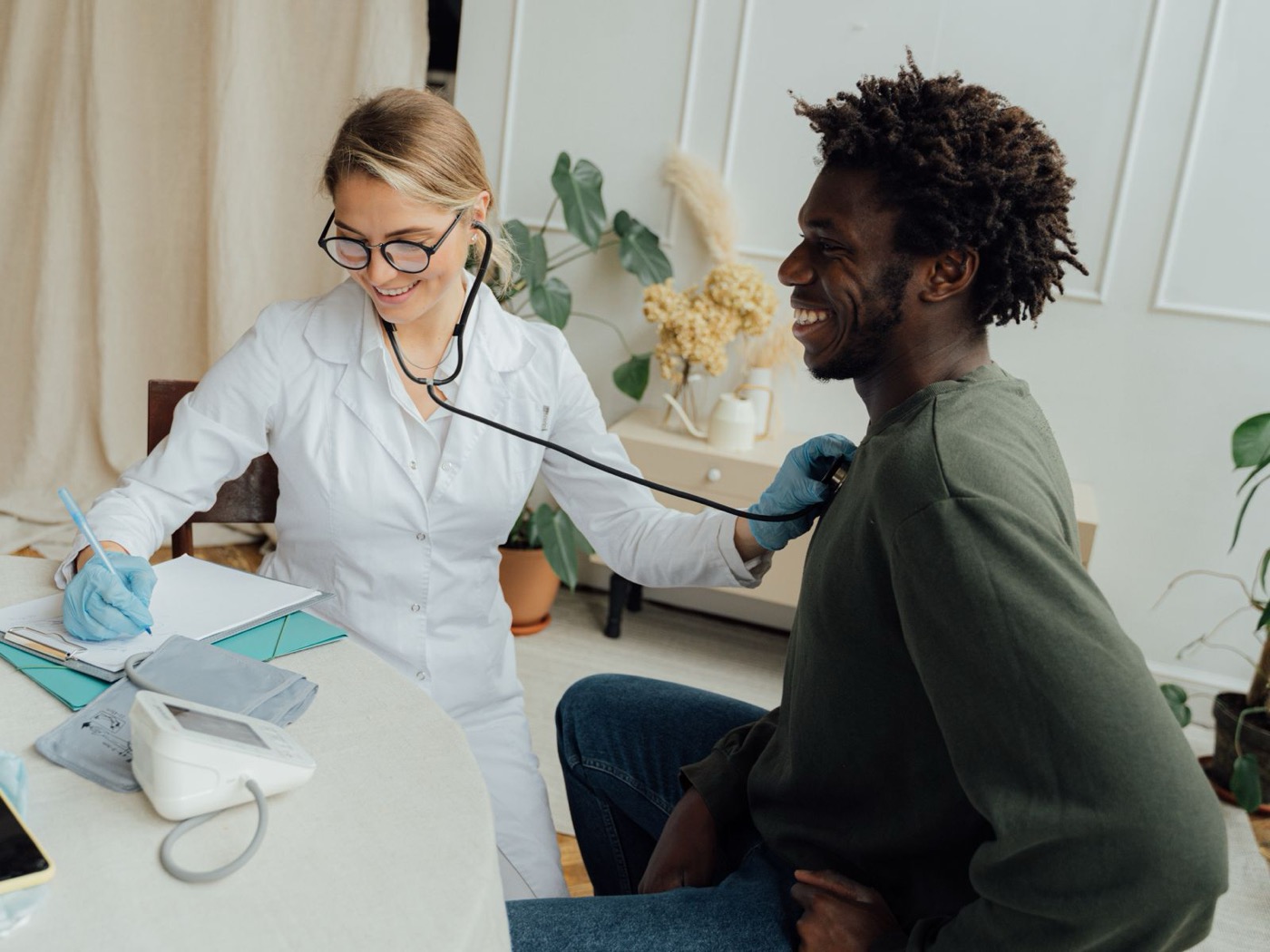 Clinician examining a patient during an occupational health visit